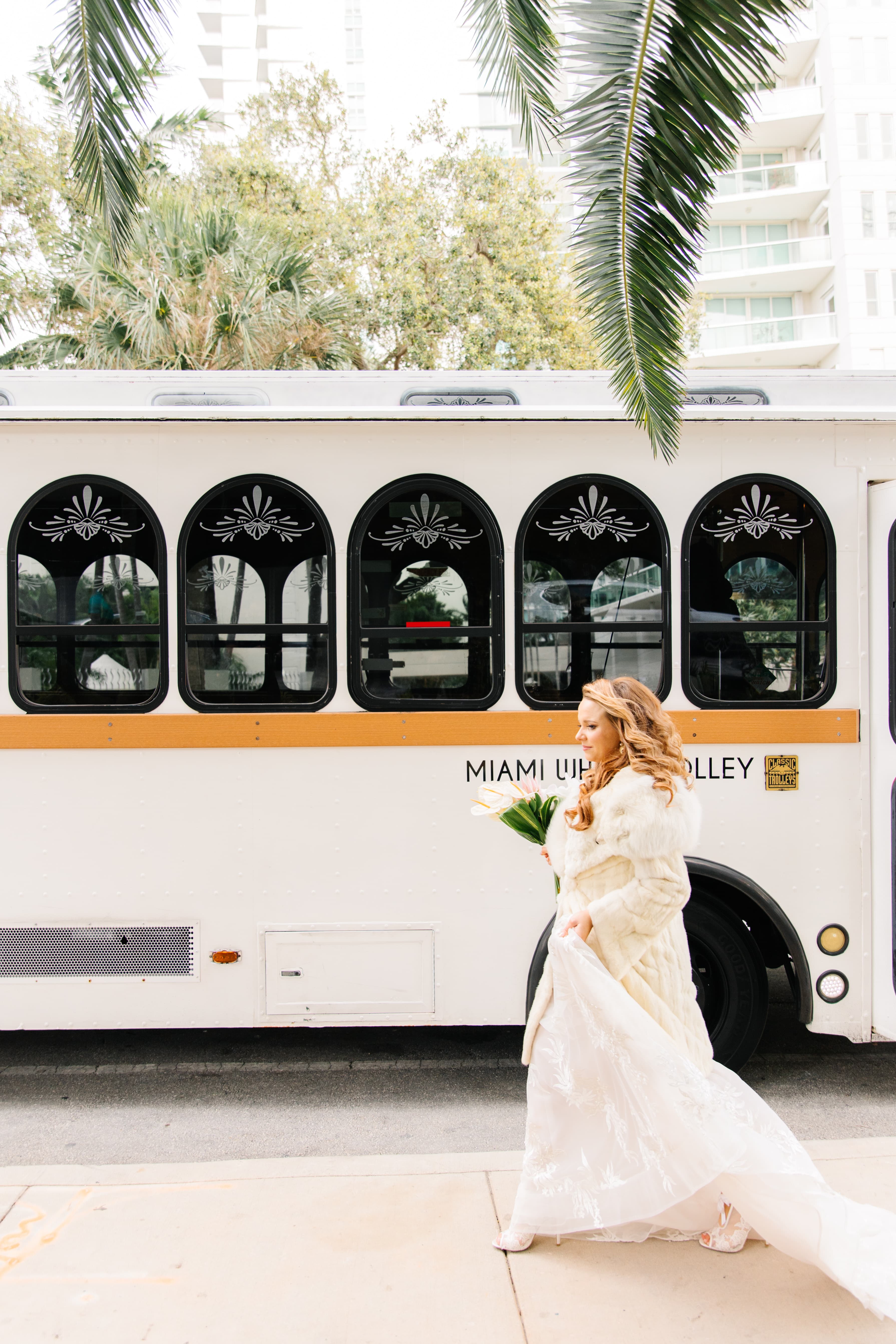 Bride walking near wedding trolley